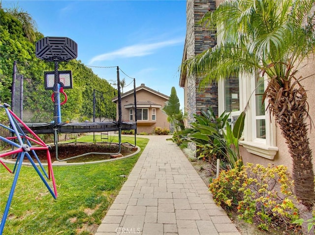 27020 Daisy Cir, Yorba Linda, CA 92887 - view of green lawn featuring a trampoline