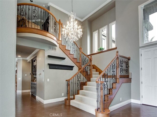 27020 Daisy Cir, Yorba Linda, CA 92887 - entrance foyer featuring a towering ceiling, stairs, a chandelier, and crown molding