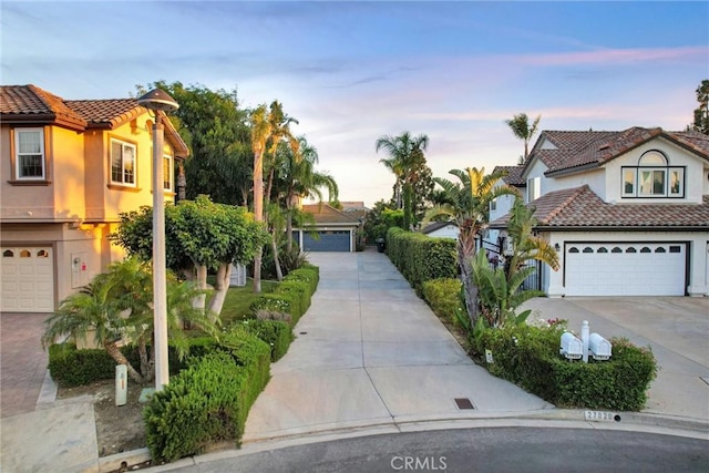 27020 Daisy Cir, Yorba Linda, CA 92887 - mediterranean / spanish home with stucco siding, a tile roof, concrete driveway, and a garage