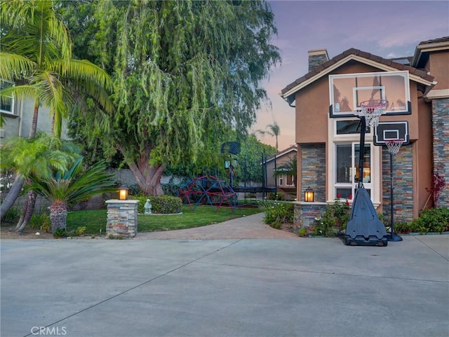 27020 Daisy Cir, Yorba Linda, CA 92887 - view of front of home with stucco siding, a chimney, and stone siding