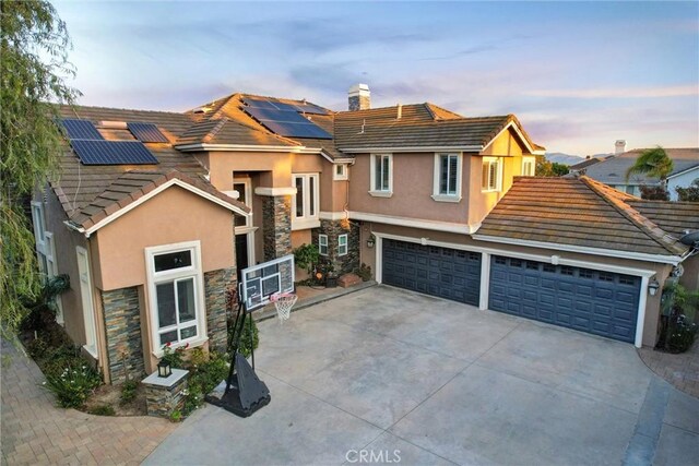 27020 Daisy Cir, Yorba Linda, CA 92887 - view of front facade with stone siding, stucco siding, a chimney, and a tile roof
