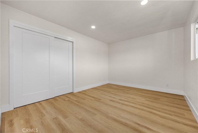 3009 Delburn St, Bakersfield, CA 93304 - unfurnished bedroom featuring recessed lighting, light wood finished floors, and a closet