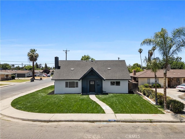 3009 Delburn St, Bakersfield, CA 93304 - view of front of home featuring a front lawn and roof with shingles