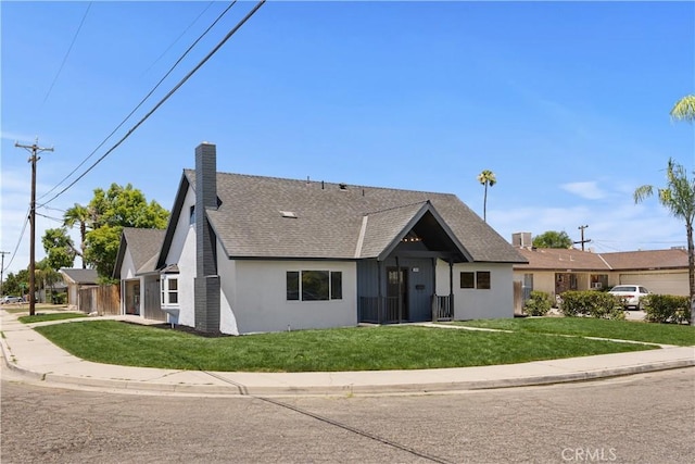 3009 Delburn St, Bakersfield, CA 93304 - view of front facade with a front yard, roof with shingles, stucco siding, and a chimney