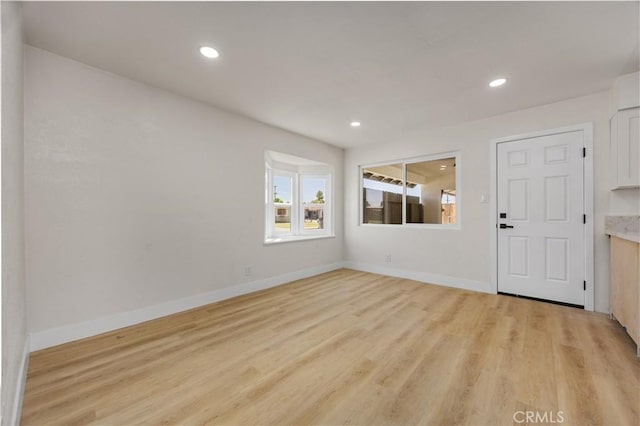 3009 Delburn St, Bakersfield, CA 93304 - unfurnished living room with light wood-style flooring and recessed lighting