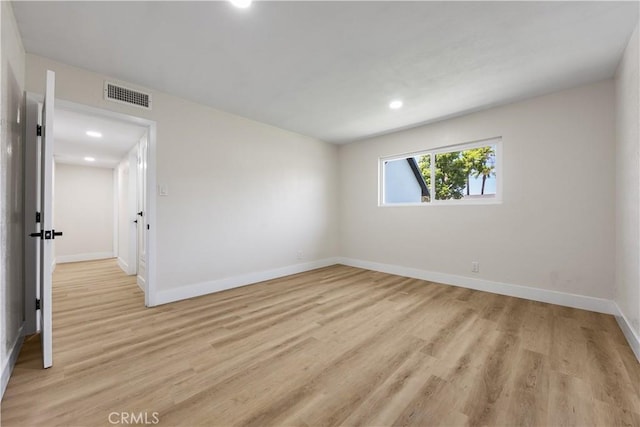 3009 Delburn St, Bakersfield, CA 93304 - empty room with light wood-style flooring and recessed lighting