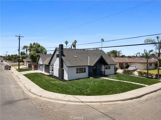 3009 Delburn St, Bakersfield, CA 93304 - view of front of home featuring roof with shingles, a garage, stucco siding, a front yard, and driveway