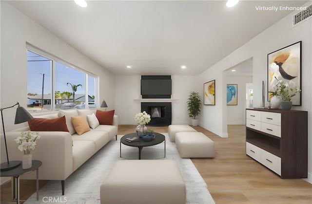 3009 Delburn St, Bakersfield, CA 93304 - living area with recessed lighting, light wood-style floors, and a glass covered fireplace