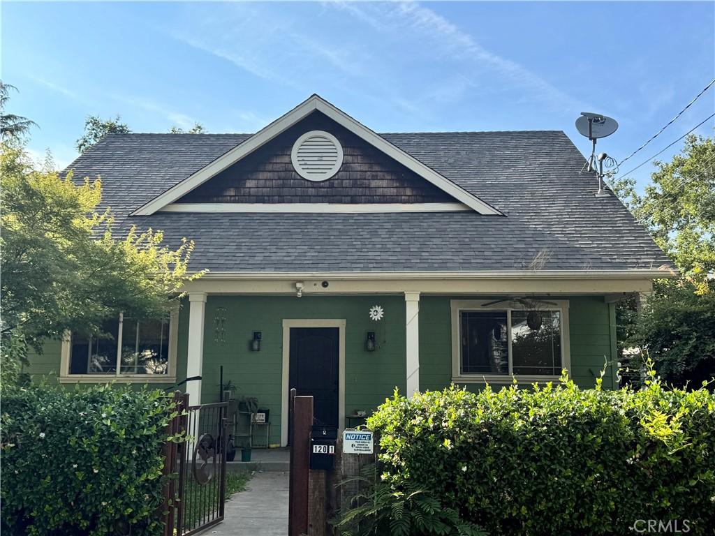120 W 21st St Unit 1, Chico, CA 95928 - view of front of house with roof with shingles and a gate