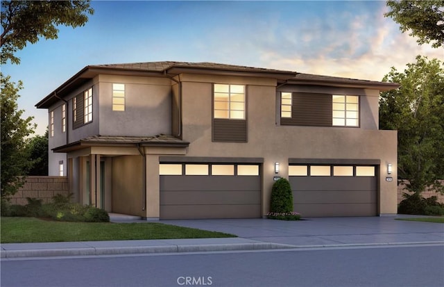 111 Moonflower Rd, Rancho Mission Viejo, CA 92694 - prairie-style home with an attached garage, concrete driveway, and stucco siding
