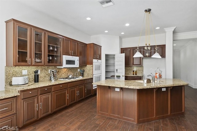 29530 Winding Brook Dr, Menifee, CA 92584 - kitchen featuring white appliances, glass insert cabinets, backsplash, pendant lighting, and light stone counters