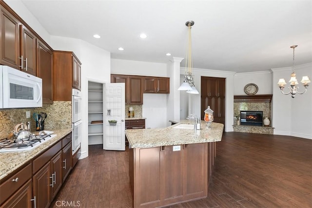 29530 Winding Brook Dr, Menifee, CA 92584 - kitchen with white appliances, dark wood finished floors, backsplash, pendant lighting, and recessed lighting
