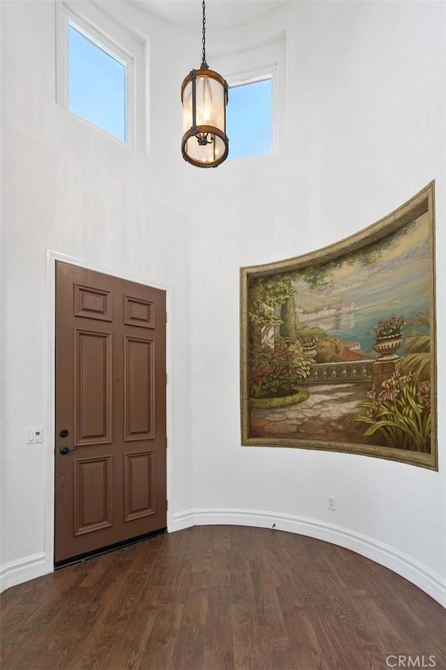 29530 Winding Brook Dr, Menifee, CA 92584 - entrance foyer with dark wood-type flooring, plenty of natural light, and a towering ceiling
