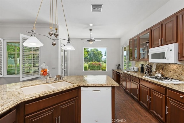 29530 Winding Brook Dr, Menifee, CA 92584 - kitchen with white appliances, dark wood-style flooring, glass insert cabinets, ceiling fan, and light stone countertops