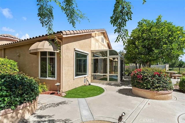 29530 Winding Brook Dr, Menifee, CA 92584 - back of house featuring a patio, stucco siding, and a tiled roof