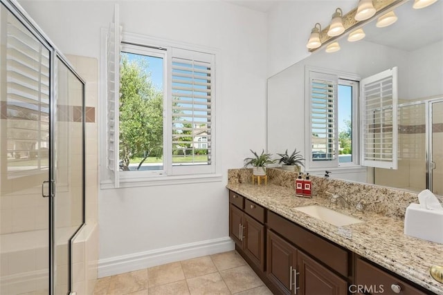 29530 Winding Brook Dr, Menifee, CA 92584 - full bathroom with vanity, plenty of natural light, tile patterned flooring, and a shower stall