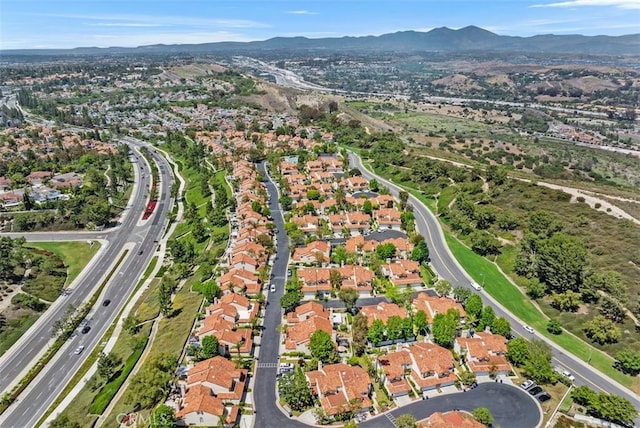50 Niguel Pointe Dr Unit 118, Laguna Niguel, CA 92677 - aerial overview of property's location with a mountainous background and nearby suburban area