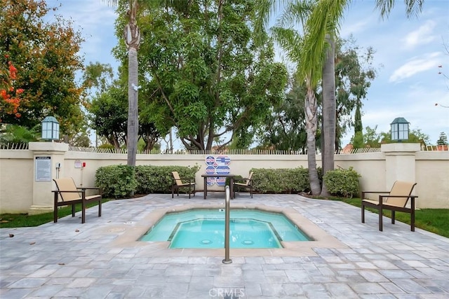 50 Niguel Pointe Dr Unit 118, Laguna Niguel, CA 92677 - view of pool with a hot tub and a patio