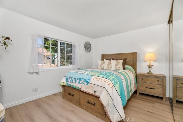 50 Niguel Pointe Dr Unit 118, Laguna Niguel, CA 92677 - bedroom featuring light wood-style flooring and baseboards