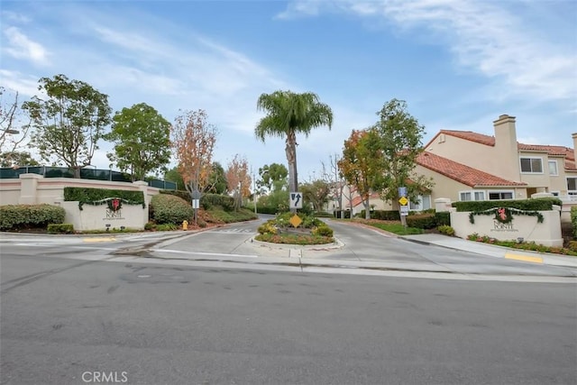 50 Niguel Pointe Dr Unit 118, Laguna Niguel, CA 92677 - view of asphalt street with traffic signs, sidewalks, curbs, and a residential view