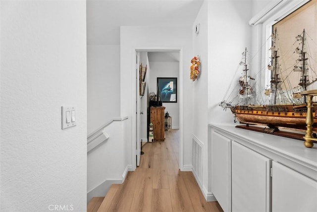 50 Niguel Pointe Dr Unit 118, Laguna Niguel, CA 92677 - corridor featuring light wood finished floors