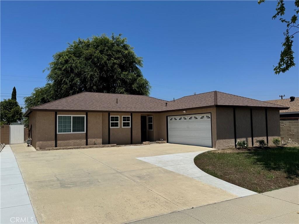 1343 Cherry Ave, Simi Valley, CA 93065 - ranch-style house with driveway, stucco siding, and a garage