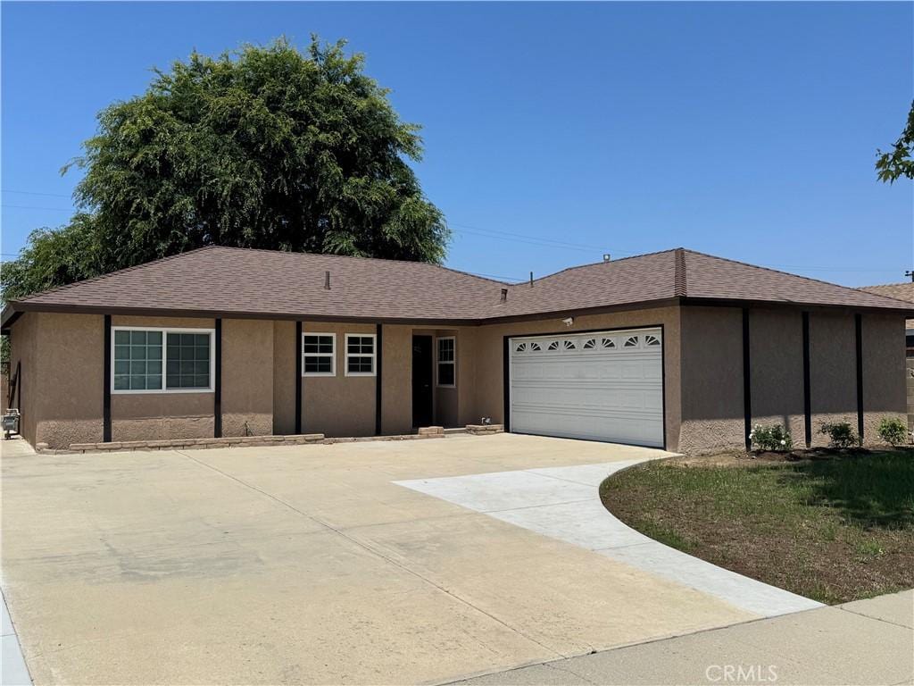 1343 Cherry Ave, Simi Valley, CA 93065 - ranch-style house featuring concrete driveway, a garage, and stucco siding