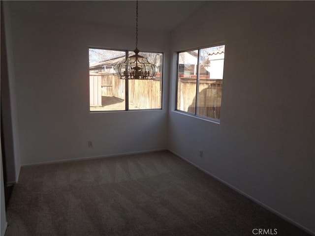 3407 Amber St, Rosamond, CA 93560 - unfurnished dining area featuring a chandelier, carpet flooring, and lofted ceiling