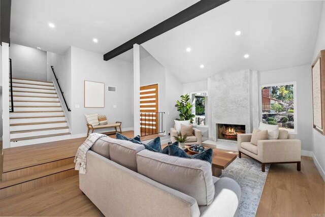10594 Rookwood Dr, San Diego, CA 92131 - living area with light wood-type flooring, recessed lighting, a high end fireplace, and stairway