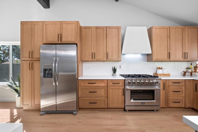 10594 Rookwood Dr, San Diego, CA 92131 - kitchen with appliances with stainless steel finishes, custom range hood, lofted ceiling, light countertops, and light wood-style floors