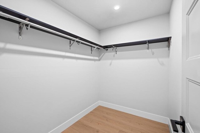 10594 Rookwood Dr, San Diego, CA 92131 - spacious closet with light wood finished floors