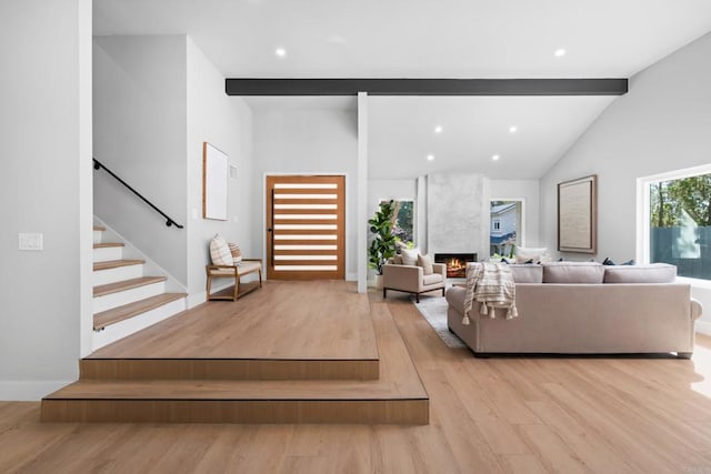 10594 Rookwood Dr, San Diego, CA 92131 - living area with light wood-style floors, a premium fireplace, stairway, and recessed lighting