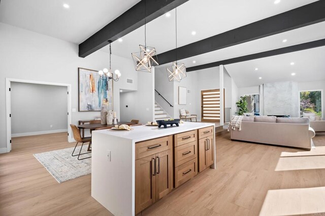 10594 Rookwood Dr, San Diego, CA 92131 - kitchen with a chandelier, light wood-style floors, decorative light fixtures, open floor plan, and recessed lighting