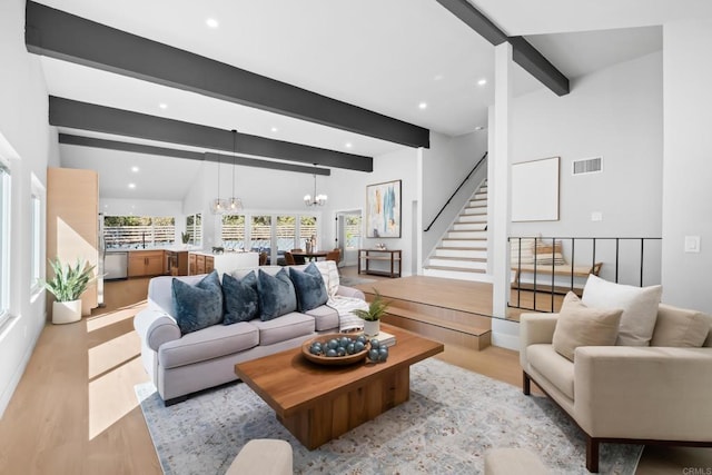 10594 Rookwood Dr, San Diego, CA 92131 - living room featuring light wood-style flooring, a chandelier, recessed lighting, and stairs