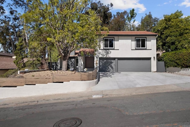 10594 Rookwood Dr, San Diego, CA 92131 - view of front of home featuring an attached garage, stucco siding, concrete driveway, and a tile roof