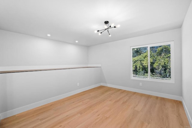 10594 Rookwood Dr, San Diego, CA 92131 - spare room with a chandelier, light wood-type flooring, and recessed lighting