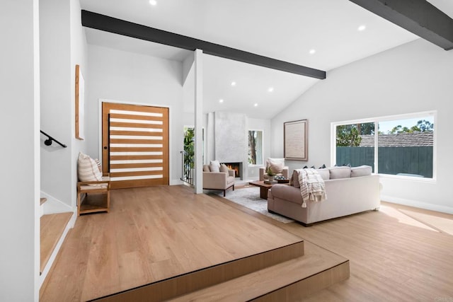 10594 Rookwood Dr, San Diego, CA 92131 - living area featuring light wood-style flooring, a fireplace, recessed lighting, and stairway
