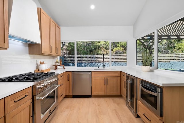 10594 Rookwood Dr, San Diego, CA 92131 - kitchen with appliances with stainless steel finishes, premium range hood, light wood-style floors, light countertops, and wine cooler
