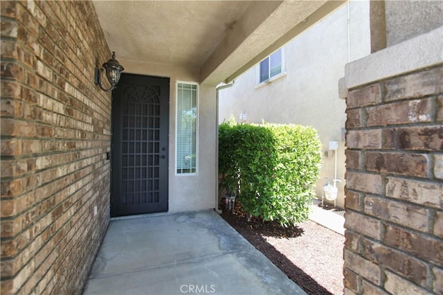 11961 Limestone Ct, Yucaipa, CA 92399 - property entrance featuring stucco siding