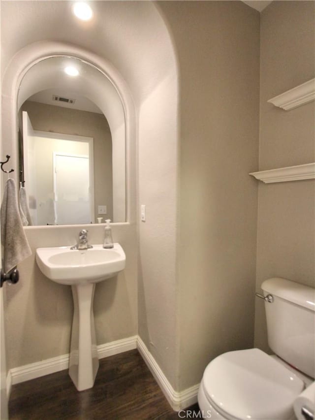 11961 Limestone Ct, Yucaipa, CA 92399 - bathroom with toilet and wood finished floors