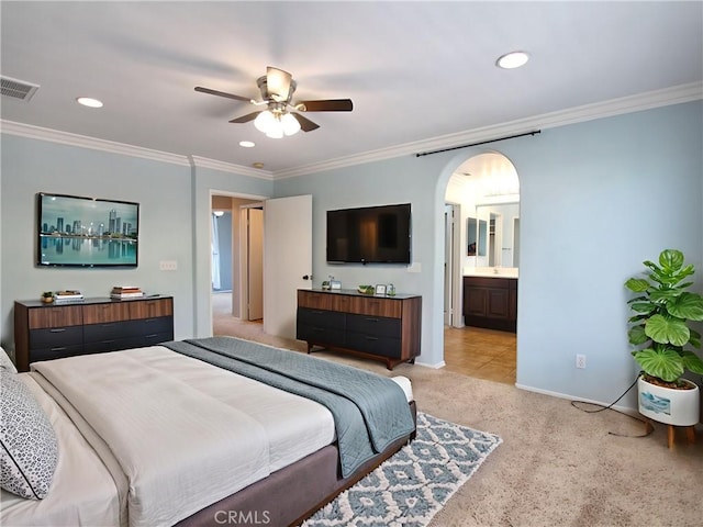11961 Limestone Ct, Yucaipa, CA 92399 - bedroom with crown molding, light carpet, recessed lighting, arched walkways, and ensuite bath