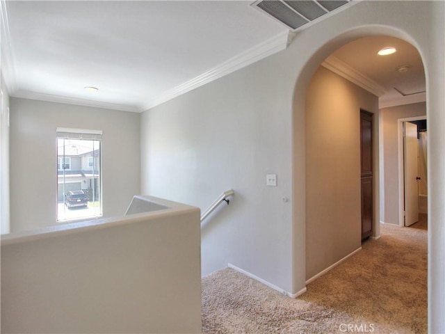 11961 Limestone Ct, Yucaipa, CA 92399 - corridor featuring carpet floors, arched walkways, ornamental molding, and an upstairs landing