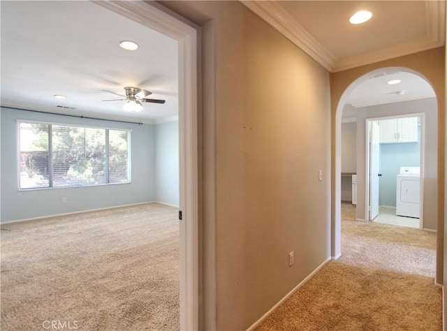11961 Limestone Ct, Yucaipa, CA 92399 - corridor with washer / dryer, arched walkways, crown molding, light carpet, and recessed lighting
