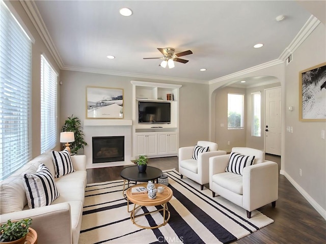 11961 Limestone Ct, Yucaipa, CA 92399 - living area with arched walkways, wood finished floors, plenty of natural light, ceiling fan, and recessed lighting