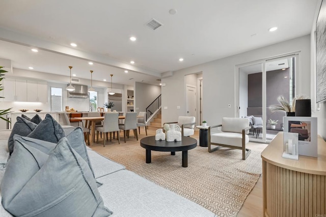 3584 Garfield St, Carlsbad, CA 92008 - living room with recessed lighting, stairs, and light wood-style flooring