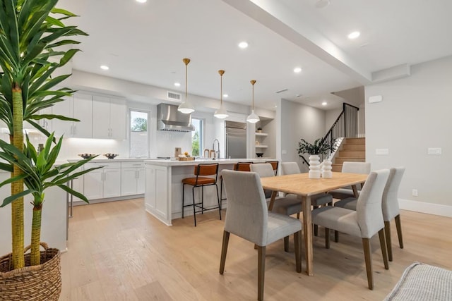 3584 Garfield St, Carlsbad, CA 92008 - dining space featuring stairway, light wood-style floors, and recessed lighting