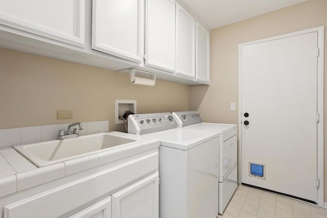 943 Masters Dr, Oceanside, CA 92057 - washroom featuring cabinet space, separate washer and dryer, and light tile patterned floors