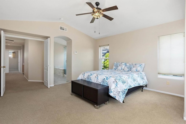 943 Masters Dr, Oceanside, CA 92057 - bedroom with light colored carpet, arched walkways, vaulted ceiling, and ceiling fan