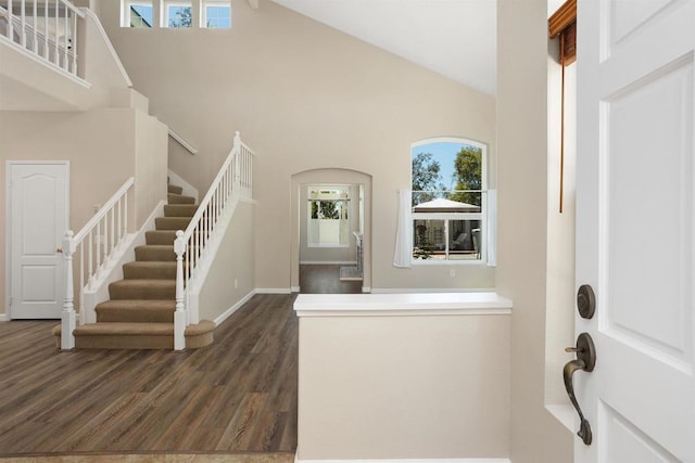 943 Masters Dr, Oceanside, CA 92057 - foyer entrance featuring high vaulted ceiling, stairs, and dark wood-style floors