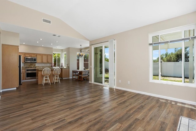 943 Masters Dr, Oceanside, CA 92057 - unfurnished living room with a chandelier, dark wood-style flooring, and vaulted ceiling